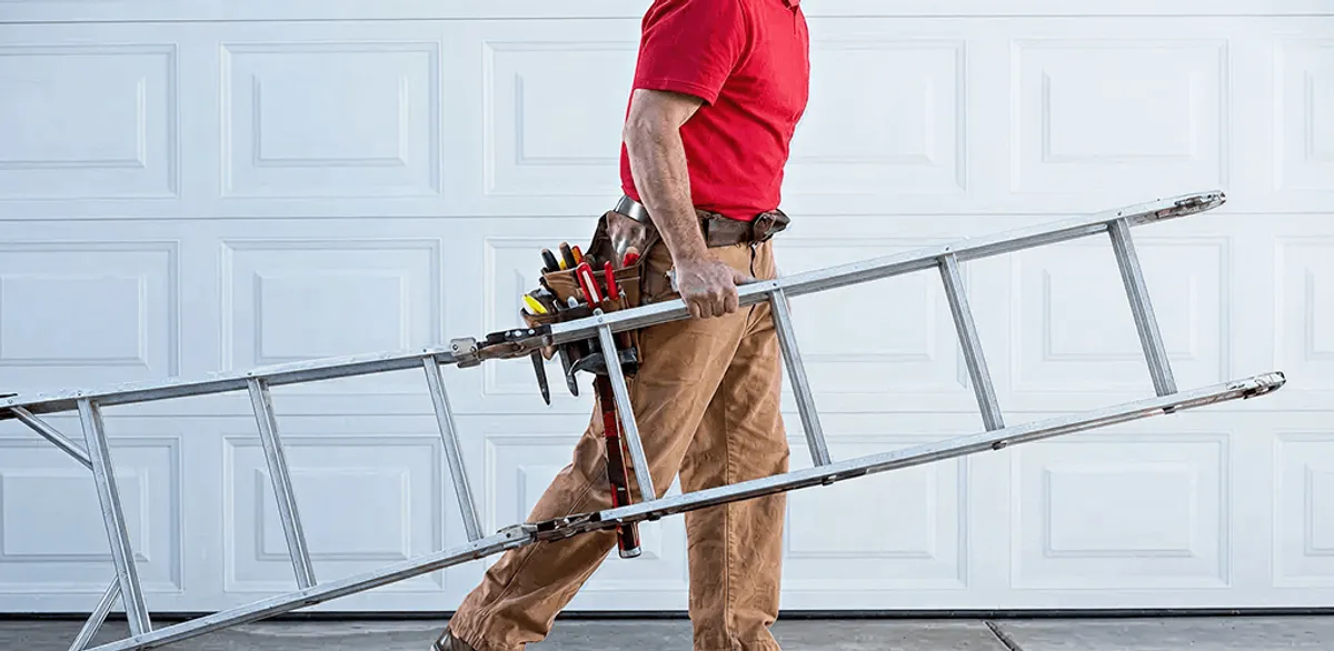 Garage door repair technician arriving with tools and ladder in Long Beach, CA